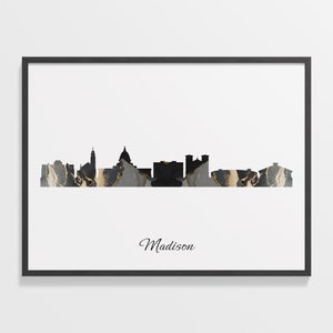 Puede incluir: Silueta en blanco y negro del horizonte de Madison, Wisconsin, con una textura de mármol en gris, negro y dorado. El nombre de la ciudad está escrito en cursiva debajo del horizonte.