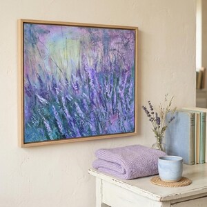 Dreamy abstract artwork of lavender flowers swaying in soft purples and blues, layered over a pastel sunrise backdrop.