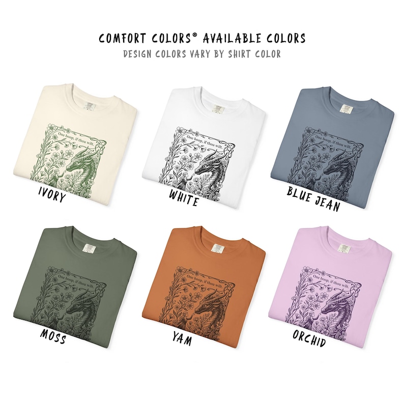 May include: Six t-shirts in ivory, white, blue jean, moss, yam, and orchid colors. Each shirt features a black line art graphic of a dragon surrounded by flowers and the text "One beep, if thou wilt." The top text reads "COMFORT COLORS AVAILABLE COLORS."