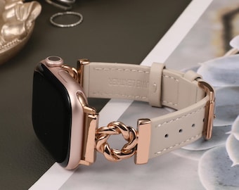 May include: A rose gold Apple Watch band with a braided chain detail and a light beige leather strap. The band is designed for the Apple Watch Series 4 and later.