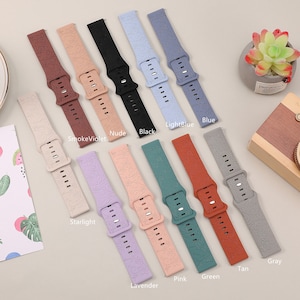 May include: Ten different colored silicone watch bands with a floral pattern. The colors are: smoke violet, nude, black, light blue, blue, starlight, lavender, pink, green, tan, and gray.