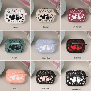 May include: Ten different colored Airpod cases with a Mickey Mouse and Minnie Mouse design. The cases are white, green, light blue, black with red accents, pink, black with pink accents, black with white accents, starlight, smoke violet, and black.