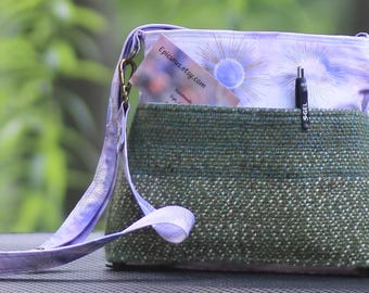 Crossbody bag featuring hand dyed and handwoven fabric in green and purple