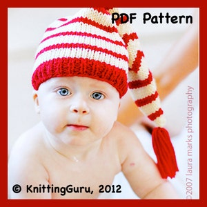 May include: A baby wearing a red and white striped knitted hat with a long pointy tip. The hat has a tassel at the end of the tip. The baby is looking at the camera. The text "PDF Pattern" is in the top right corner of the image. The text "© KnittingGuru, 2012" is in the bottom left corner of the image.