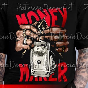 May include: Black t-shirt with a red graphic that says "MONEY MAKER". The graphic features hands holding a stack of $100 bills and a money clip. The design includes gold rings and a money clip.