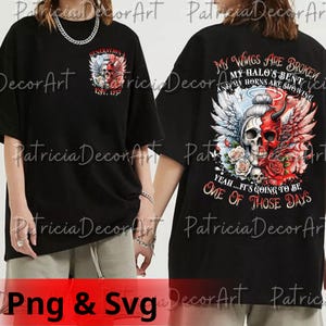 May include: Black t-shirt with a graphic design featuring a skull with angel and devil wings, roses, and the text "GENERATION X EST. 1959" on the front. The back of the shirt has the text "MY WINGS ARE BROKEN...ONE OF THOSE DAYS."