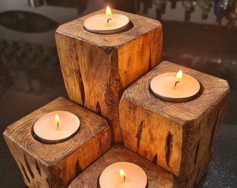 Set of 4 Beautiful tea light holders. Largest 13.5cm x 6.5cm x 6.5cm. Hand crafted and distressed to create a stunning  unique finish.