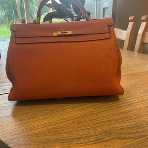 classic hermes kelly 35 from the 90's in good condition , orange and gold