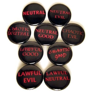 May include: Nine black button pins with white text and red outlines. The pins depict the nine alignment categories from Dungeons and Dragons: Lawful Good, Neutral Good, Chaotic Good, Lawful Neutral, True Neutral, Chaotic Neutral, Lawful Evil, Neutral Evil, and Chaotic Evil.
