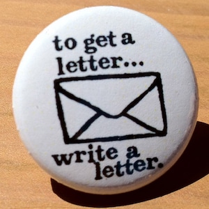 To get a letter write a letter - button, magnet, bottle opener