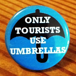 In Portland ONLY TOURISTS use UMBRELLAS Button, Magnet, or Bottle Opener image 1