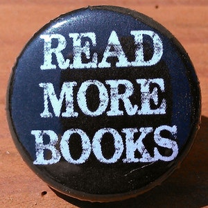 May include: A black button with white text that reads "READ MORE BOOKS".