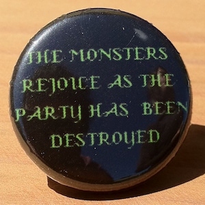 May include: A black button with green text that reads "The Monsters Rejoice As The Party Has Been Destroyed".