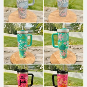 May include: A trio of ceramic mugs with a speckled, matte finish in cream, light grey, and dark grey. Each mug features a simple, minimalist design, ideal for tea or coffee.