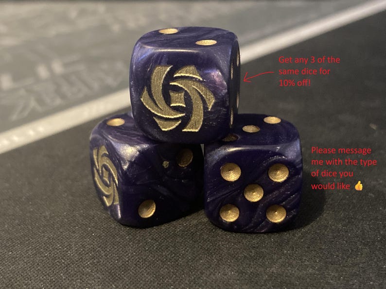 May include: Three dark blue dice with gold-colored pips and a gold emblem on one face. The dice are stacked, with the text "Get any 3 of the same dice for 10% off!" and "Please message me with the type of dice you would like" in the background.