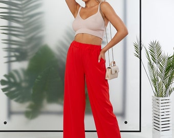 Pantalon taille haute avec élastique et poches latérales en tissu d'été léger