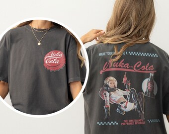 Fallout Grafik-T-Shirt, Retro-Nuka-Cola-Flaschenverschluss mit Vintage-Werbung auf der Rückseite, Videospiel-Shirt, Fallout Vault tec-Memorabilia Merch-T-Shirt