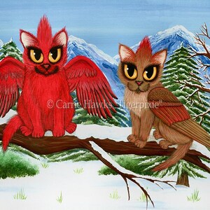 May include: Two red and brown winged cats with yellow eyes perched on a branch in a snowy winter landscape. The cats have a spiky red crest on their heads. The background features a snowy mountain range and pine trees.