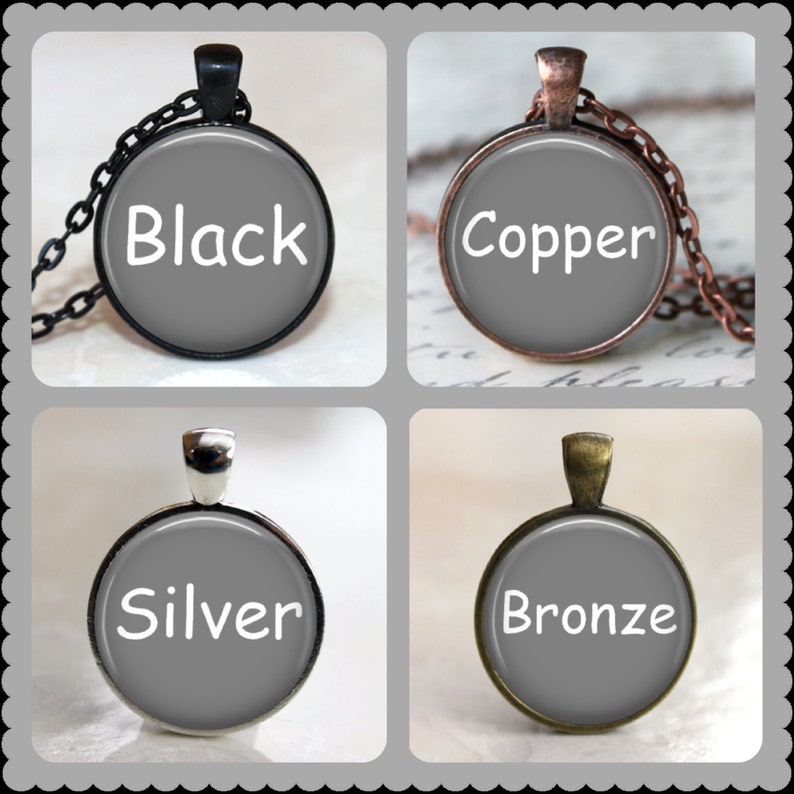 May include: Four pendant necklaces with gray backgrounds and white text. The pendants are in black, copper, silver, and bronze finishes. Each pendant has a matching chain. The text on each pendant reads "Black", "Copper", "Silver", and "Bronze".