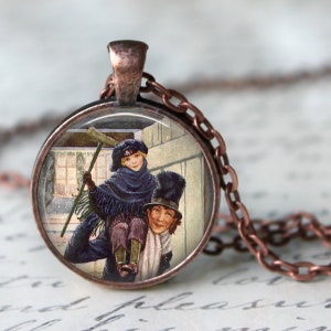 May include: A round pendant necklace with a copper-colored chain. The pendant features a vintage illustration of a child on a man's shoulders, both in winter attire. The illustration is set against a snowy backdrop.