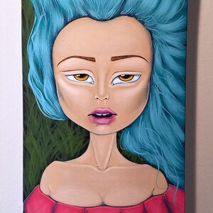 May include: A painted skateboard deck featuring a stylized woman with blue hair and a red dress. A butterfly rests on the hair. The woman holds a glass of red wine. The background is green.