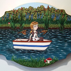 May include: A painting of a young woman in a brown dress sitting in a white rowboat on a blue lake. The woman has blonde hair and is looking to the right. There are green reeds and blue flowers on the shore of the lake.