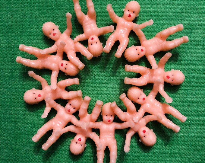 tiny plastic dolls