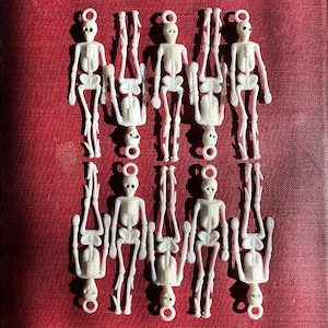 4pcs MINI SKELETON CHARMS 2-1/2" Vintage Plastic Charm Gum Ball Prize Halloween Doll House Skull + Bones