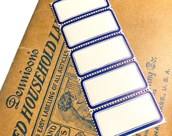 May include: A strip of five rectangular labels with a white interior and a blue border. The labels are on a brown paper background with the text "Dennison's MED HOUSEHOLD LA" and other text. The labels are for labeling articles.