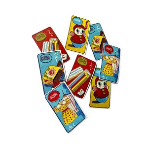 May include: A collection of vintage-style cards with illustrations and Japanese text. The cards feature images of a doll, clothing, and school supplies. Each card has a numerical value in red or blue, and the cards are scattered on a white background.