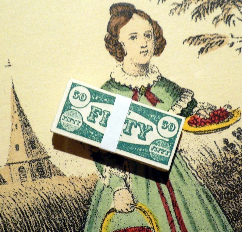 May include: A vintage green and white paper ticket with the word "FIFTY" printed on it. The ticket has a circle with the number "50" printed on it. The ticket is being held by a woman in a green dress.