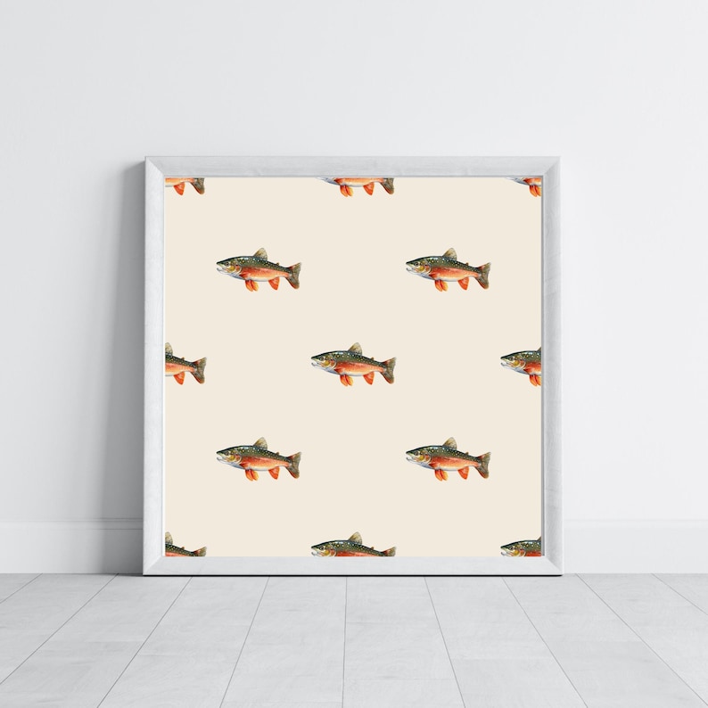 May include: A white framed print featuring a repeating pattern of brown and orange trout on a cream background.