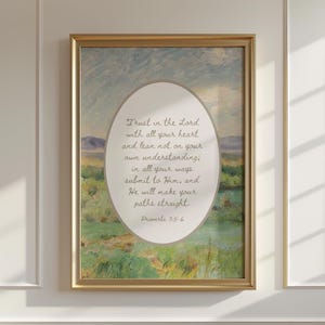 May include: Framed art print featuring an oval-shaped landscape scene with a gold frame. The artwork includes a field of green and a cloudy sky. Text within the oval reads "Trust in the Lord... Proverbs 3:5-6."