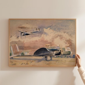 May include: Watercolor print of two vintage airplanes in flight and on the ground. The artwork features a muted color palette of browns, greens, and blues, with text that reads "Be strong and courageous. Don't be afraid for the Lord, your God will be with you."