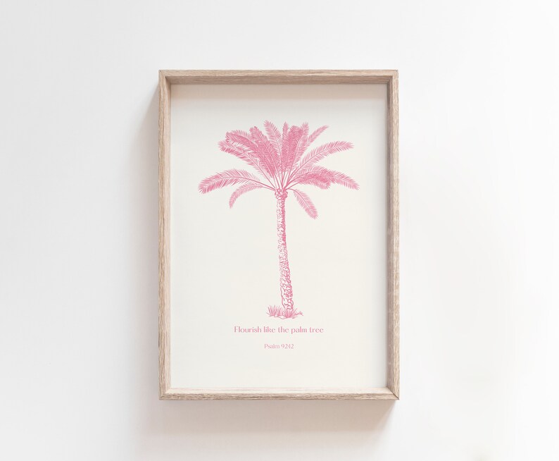 Puede incluir: Una impresi&oacute;n enmarcada con una ilustraci&oacute;n de palmera rosa y el texto "Flourish like the palm tree Psalm 92:12".