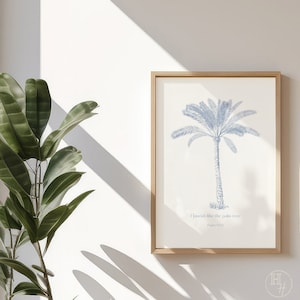 May include: A framed print featuring a blue illustration of a palm tree and the text "Flourish like the palm tree Psalm 92:12".