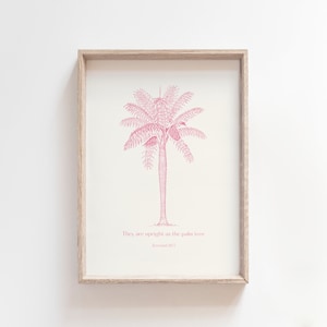 Puede incluir: Una impresi&oacute;n enmarcada con una ilustraci&oacute;n rosa de una palmera y el texto "Son rectos como la palmera, Jerem&iacute;as 10:5".