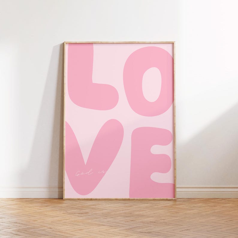 May include: Pink and white poster with the word "LOVE" in large, stylized letters. The letters are pink and have a rounded, bubbly shape. The background is a light pink gradient.