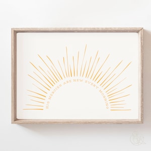 Può includere: Una stampa incorniciata con un design a raggiera giallo e il testo "Le sue misericordie sono nuove ogni mattina".