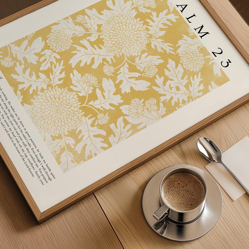 May include: A framed print with a yellow background and white floral pattern. The print includes the text "ALM 23" and a verse from Psalm 23.
