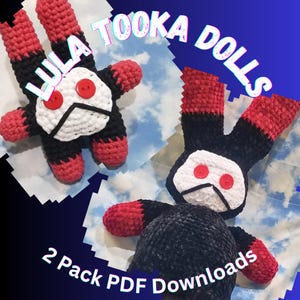 May include: Two handmade crochet dolls with black bodies, red limbs, and white faces. Each doll has two red button eyes and a black stitched mouth. The dolls are labelled "LULA TOOKA DOLLS" and "2 Pack PDF Downloads".
