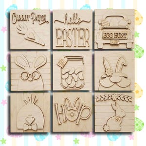 May include: Nine wooden Easter-themed squares with carved designs. The squares feature a carrot patch, the words "hello EASTER", a truck with eggs, a bunny with glasses, a jar of jelly beans, a bunny gnome, a chick, the word "HOP" with a bunny, and a bunny with flowers.