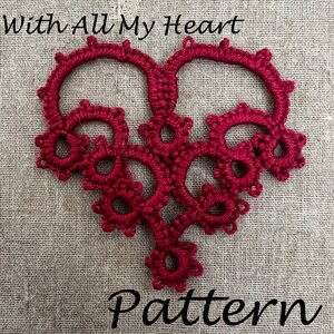 May include: A red crocheted heart with the text "With All My Heart Pattern" below it.