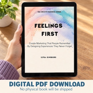 May include: A digital tablet displaying the book cover titled Feelings First, The Creative Business Series, by Ilysa Ginsburg. The cover features a soft watercolor background in pastel pink, orange, and blue hues with black text.