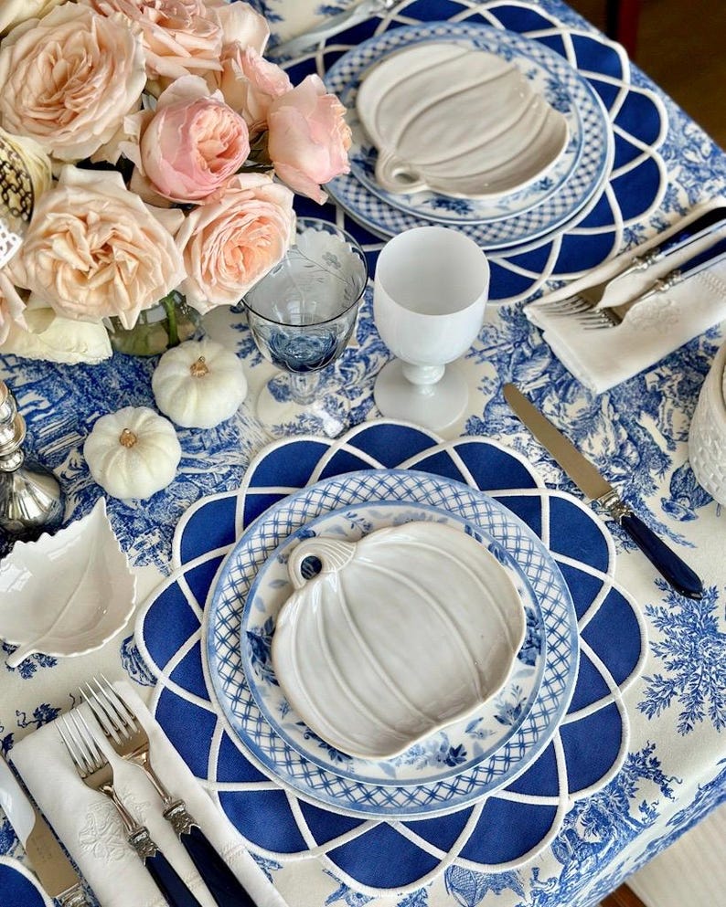 Navy blue scalloped placemat set styled for an elegant Mother’s Day table with gold cutlery and fine china, waterproof embroidered table decor, ready to ship with fast US delivery