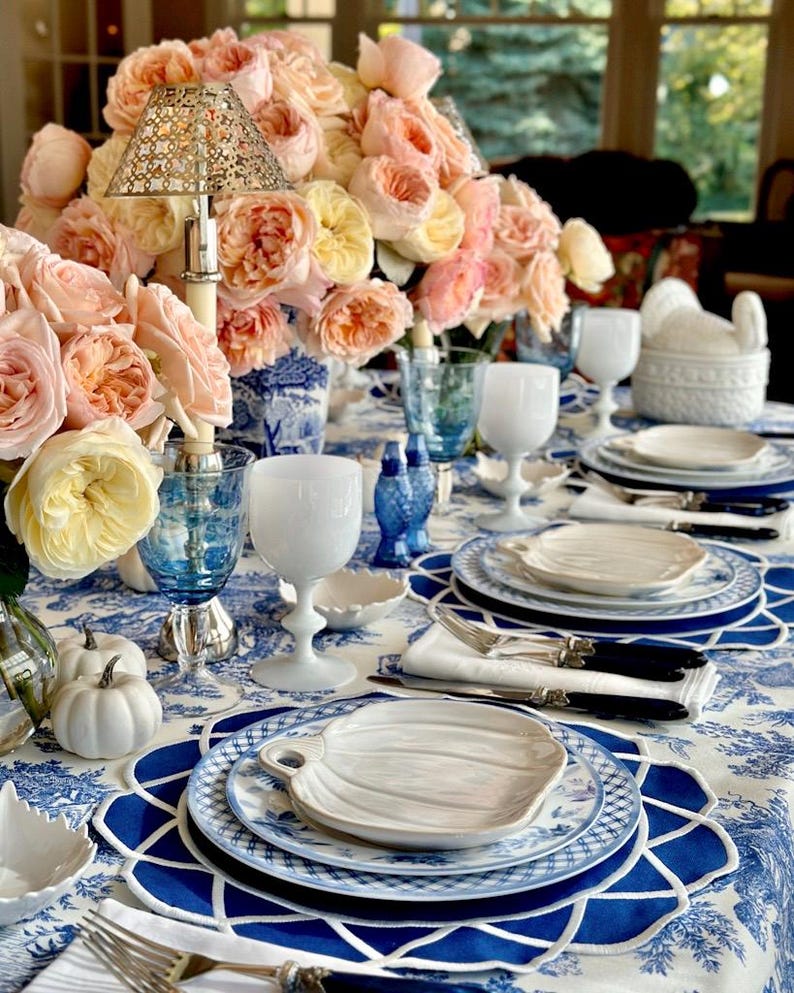 Navy blue scalloped placemat set styled for an elegant Mother’s Day table with gold cutlery and fine china, waterproof embroidered table decor, ready to ship with fast US delivery