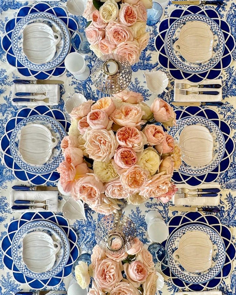 Navy blue scalloped placemat set styled for an elegant Mother’s Day table with gold cutlery and fine china, waterproof embroidered table decor, ready to ship with fast US delivery