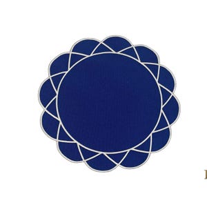 Top view of gather navy blue placemat with white embroidery, scalloped edge, and round flower design
