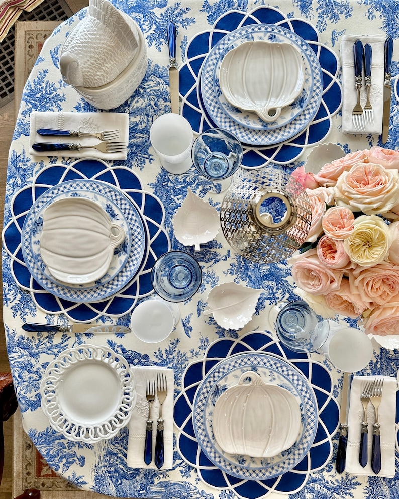 Navy blue scalloped placemat set styled for an elegant Mother’s Day table with gold cutlery and fine china, waterproof embroidered table decor, ready to ship with fast US delivery