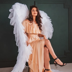 Alas de ángel grandes, alas blancas, alas de mariposa, alas de cosplay, alas para bodas y sesiones de fotos de embarazadas, alas de fiesta, alas para actuaciones.